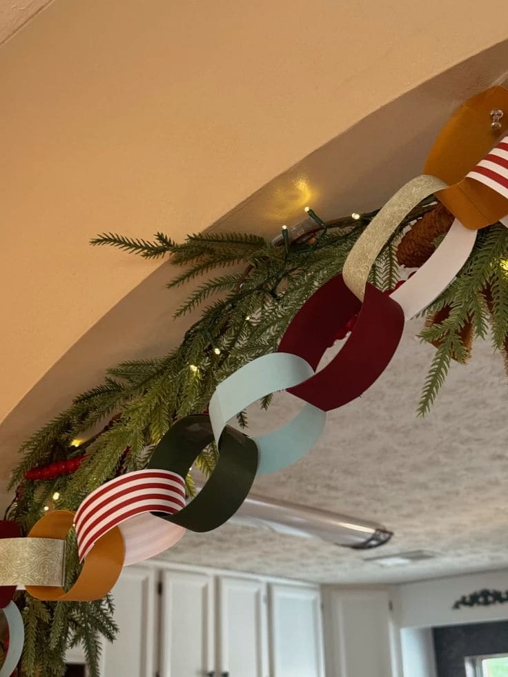 Colorful Paper Chain Garland with Festive Greenery