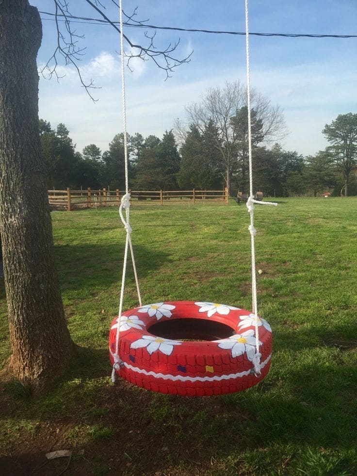 Whimsical Painted Tire Tree Swing